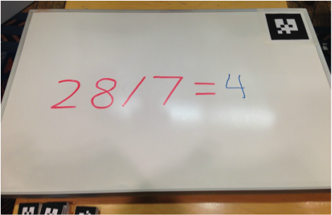 Whiteboard after Baxter has written the solution